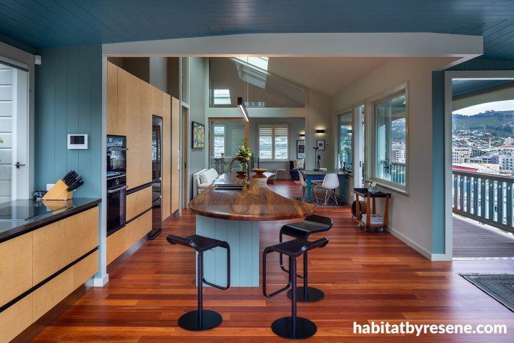 Hardwood natural floor in kitchen with blue walls