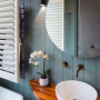 Charming bathroom painted in relaxing blue colour