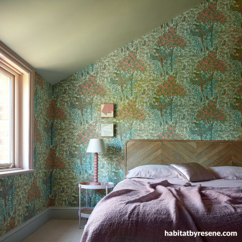 Wallpaper creates exiting outdoors atmosphere in bedroom