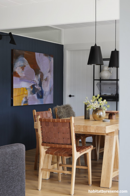 Blue feature wall adds character to dining room