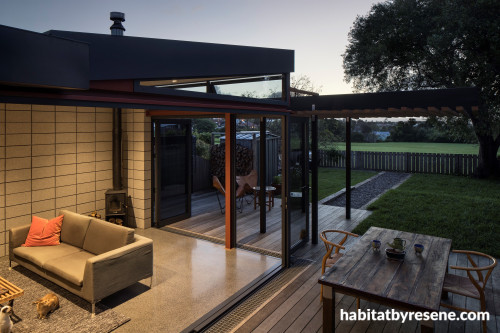 outdoor living, deck, open plan living, concrete flooring, renovated villa, black roofing 