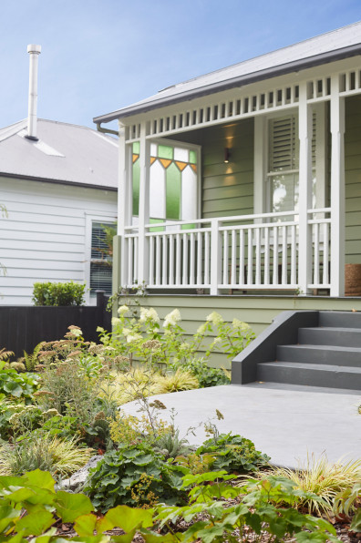 A serene villa adorned in timeless greens and whites A serene villa adorned in timeless greens and whites