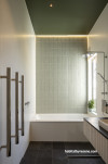 Home villa bathroom with white and green walls