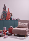 Pink room and chair with green sideboard table at Christmas