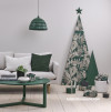 Green table in white living room at Christmas