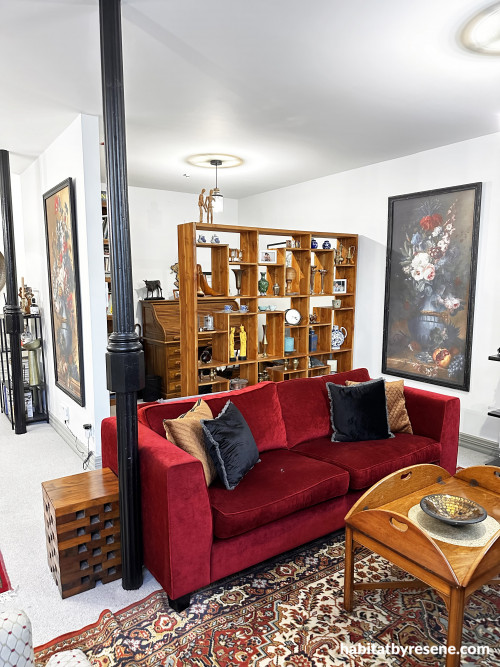 The pops of rich red and brown through décor give a nod to the history of the building. 