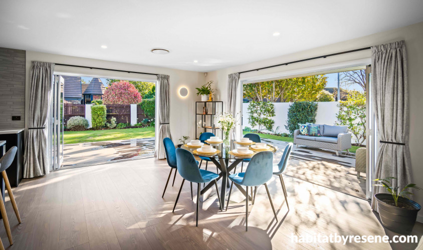 The open-plan dining has a spacious feel and new bi-fold doors allowing light and landscape to pour in. 