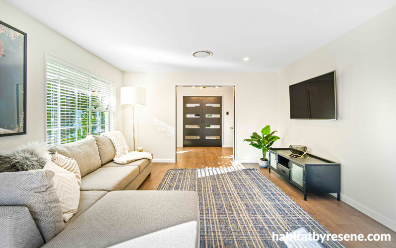 This incredibly inviting living space extends from the rest of the open-plan area, inviting guests to relax and unwind. 