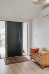 A new build that’s both chic and family-friendly with Resene Black White and Resene Wafer and a cute-as a-button play kitchen for the kids