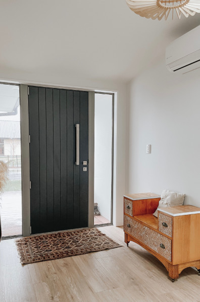 A new build that’s both chic and family-friendly with Resene Black White and Resene Wafer and a cute-as a-button play kitchen for the kids A new build that’s both chic and family-friendly with Resene Black White and Resene Wafer and a cute-as a-button play kitchen for the kids