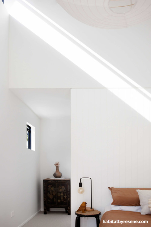 As the sun beams through the skylight, it highlights the beauty of Resene Black White on the walls, a timeless and crisp white. Trims painted in Resene Alabaster.