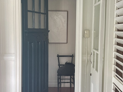 This century-old Brisbane Queenslander is transformed into a tropical oasis with summer green Resene Edgewater and Resene Warrior