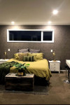 An empty Feilding paddock becomes a family home with an inspired moody dark grey colour palette including Resene Blue Charcoal and Resene Crowshead
