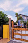 A former sailmaker’s shed becomes a colourful home to a creative family of five 
