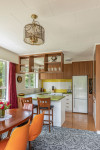 In classic 70s fashion, this Arrowtown holiday home croons Colour my World