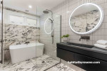 Any bathroom style seamlessly blends with Resene Eighth Black White, used in this bathroom on the ceiling and trims to complement the neutral shaded marble and finger tiles.