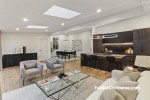 Skylights work to brighten this space naturally and show off the beauty of the oak cabinetry stained in Resene Treehouse. The walls are painted in a gentle neutral, Resene Wan White, doors in Resene Double Wan White and ceiling and trims in Resene Eighth 