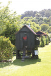 An enchanting cottage garden with a cute-as-a-button Shepherd's Hut