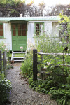 An enchanting cottage garden with a cute-as-a-button Shepherd's Hut