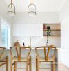 This modern and bright kitchen is painted in Resene Merino, with ceiling and trims in Resene Alabaster.