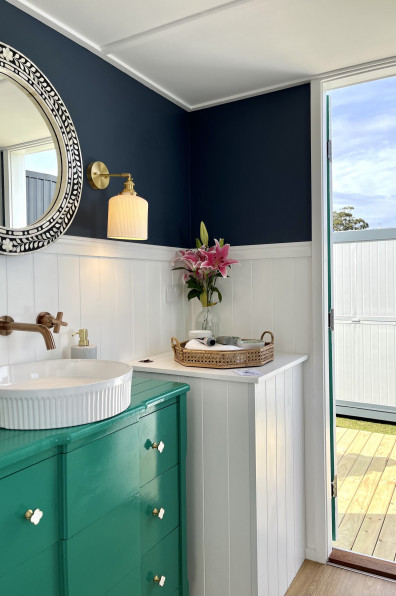 A Hamptons themed tiny home designed by lady tradies creates affordable luxury