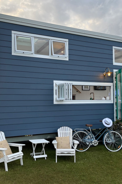 A Hamptons themed tiny home designed by lady tradies creates affordable luxury