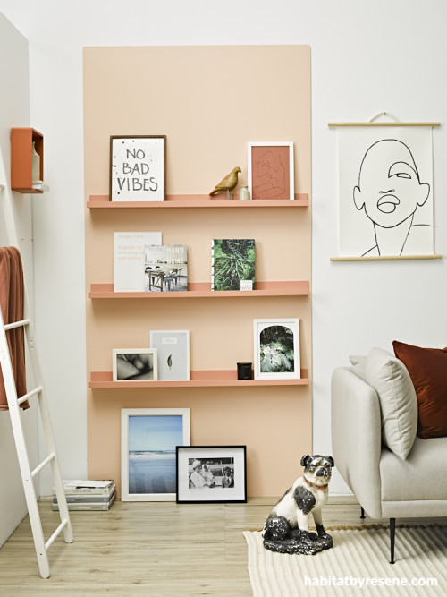 white wall peach bookshelf