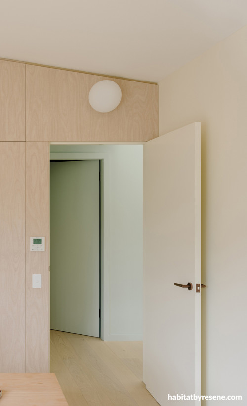 Hallway painted in Resene Quarter Lemon Grass and Resene Double Pearl Lusta