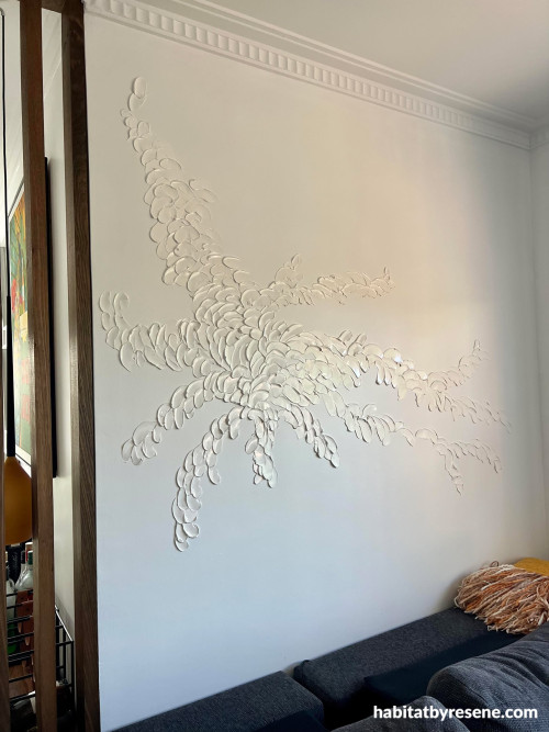 Living room with wall in neutral Resene Alabaster and artwork in Lustacryl semi-gloss