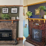 Fireplaces featuring brick surround and feature colour behind