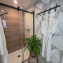Bathroom featuring hand painted mural in grey and white colours