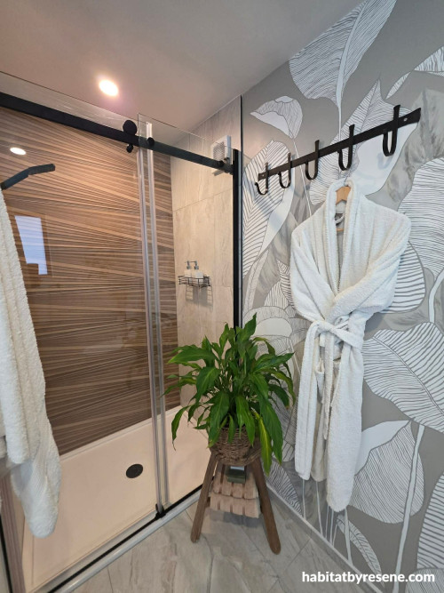 Bathroom featuring hand painted mural in grey and white colours