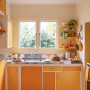 Kitchen featuring cabinetry in Resene Hero and Buttercup