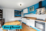 White kitchen painted with blue feature wall