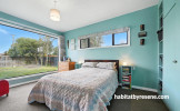 Master bedroom painted in serene green