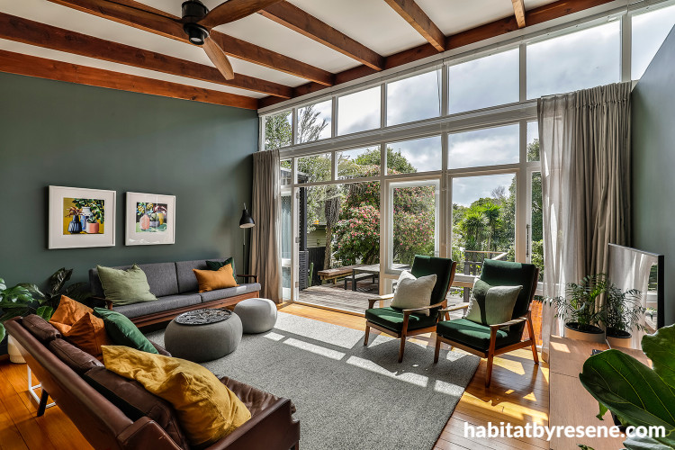 Mid-century inspired living room featuring dark green Resene Jurassic
