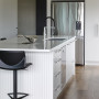 An open plan kitchen with Resene Half Sea Fog and Sandtex in Resene Ash