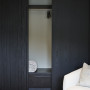 A cupboard with dark stained doors