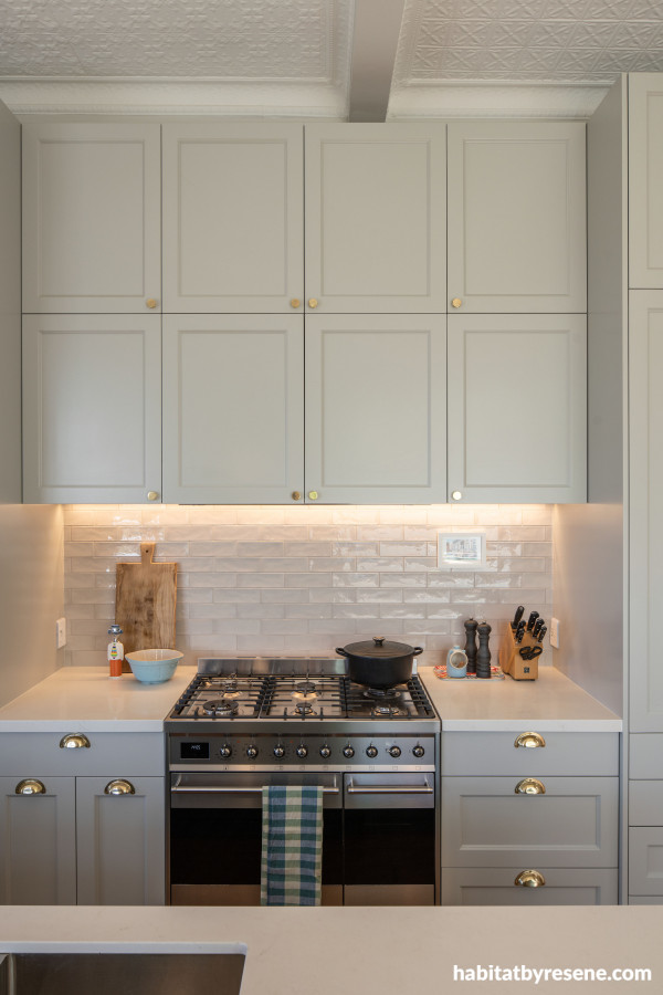 The kitchen cabinets are painted in Resene Quarter Taupe Grey, a sleek touch of taupe lightened with a hint of ochre. 