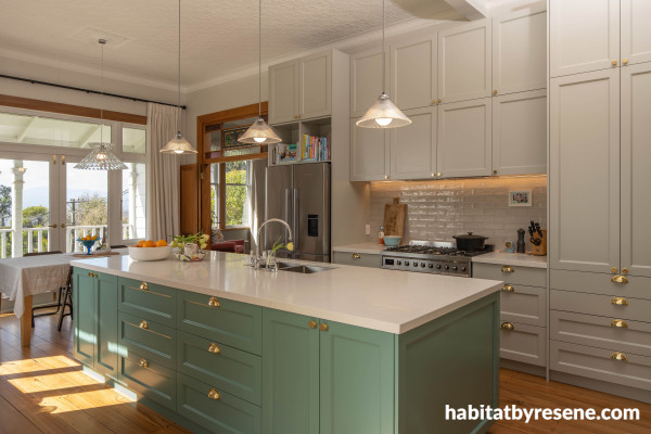 This charming kitchen is painted in a mix of gentle hues. Resene Cutty Sark was used on the kitchen island, with Resene Quarter Taupe Grey on the cabinets and Resene White on the ceiling. Timber trims are finished in Resene Aquaclear.  