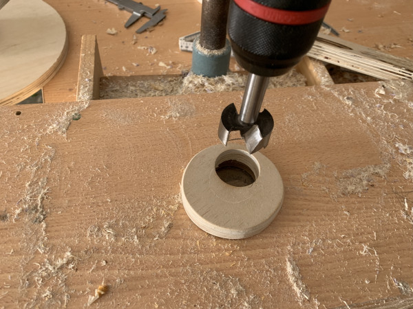 A round piece of wood with a circular hole in it