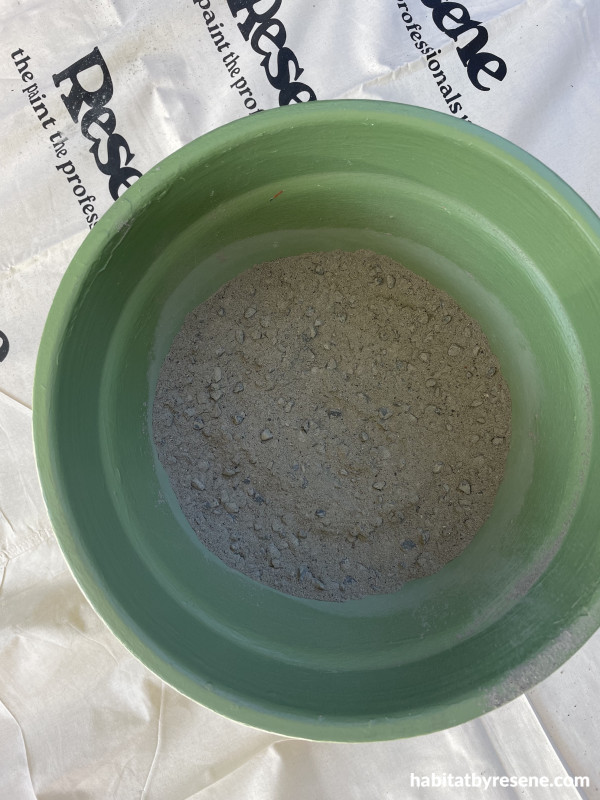 A plant pot with concrete inside