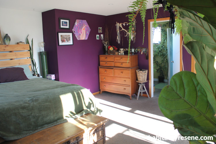 Master bedroom featuring deep purple plum tones