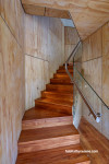 Stairwell, staircase featuring timber floors and walls