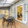 Exterior and outdoor decking area with exterior weatherboards painted in Resene Half Silver Chalice