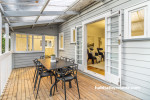 Exterior and outdoor decking area with exterior weatherboards painted in Resene Half Silver Chalice