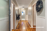 Hallway painted in Resene Tasman and Resene Black White