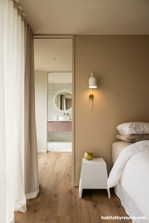 Neutral bedroom painted in Resene Double Biscotti and Resene Quarter Biscotti