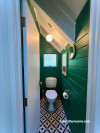 toilet is now modern and bright, painted in Resene Fun Green with Resene Quarter Rice Cake on doors and Resene Ceiling Paint White on the ceiling.&nbsp;
