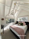 master bedroom in Resene Rice Cake and Resene Ceiling Paint White.